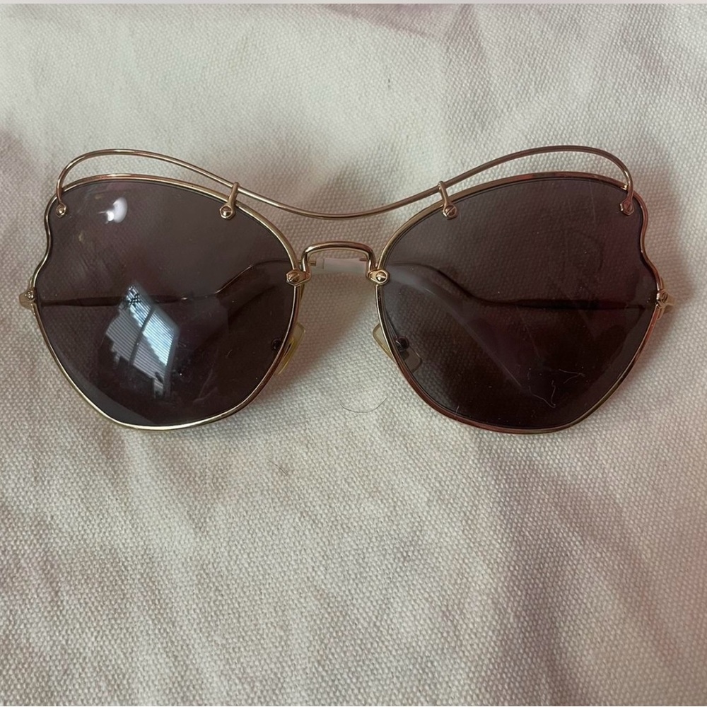 Miu Miu Gold Frame Sunglasses with Dark Lenses